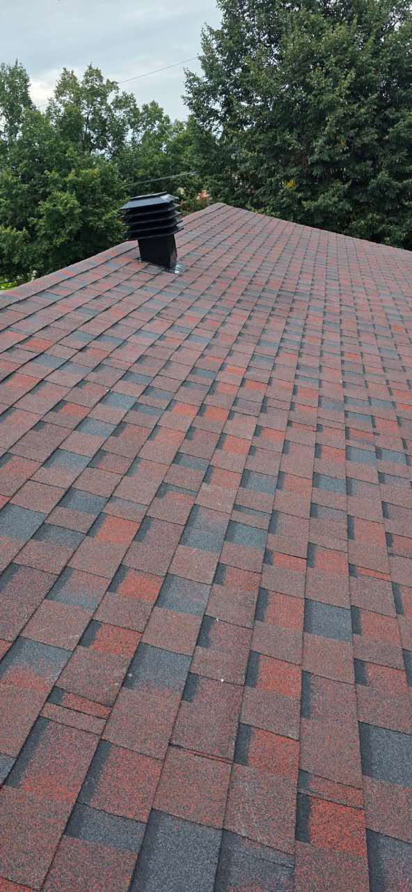 Completed shingle roof with a professionally installed roof vent