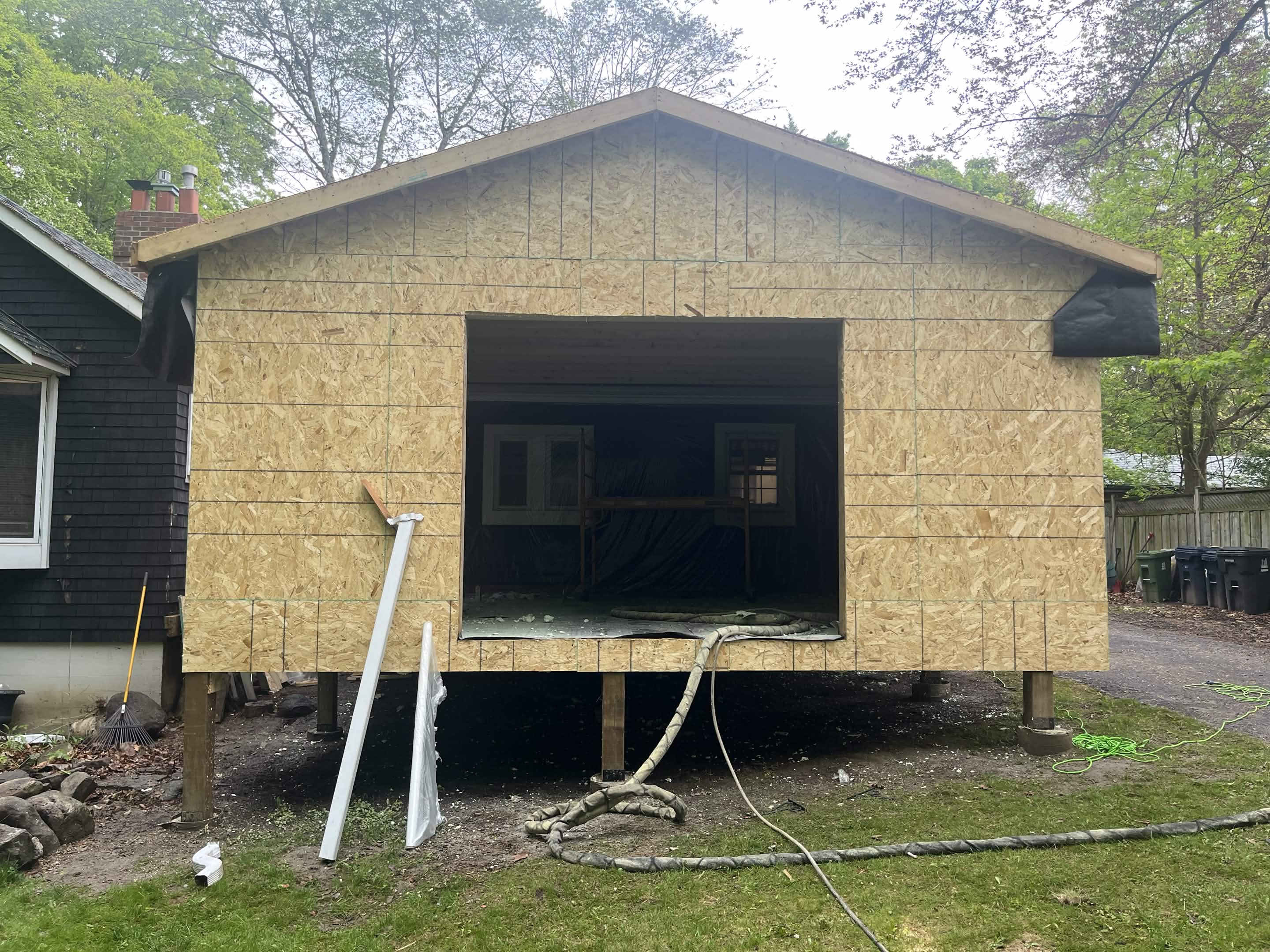 Exterior with exposed wood sheathing before siding installation